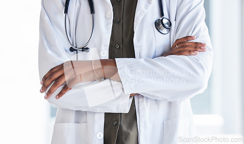 Image of Hands, doctor and arms crossed in hospital for clinic services, consultation and medical support. Closeup of cardiology expert, therapist and healthcare worker ready for surgery consulting with trust