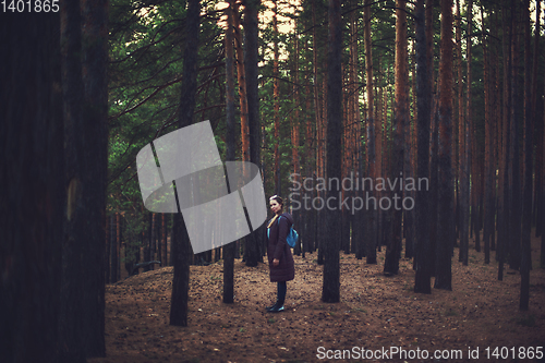 Image of Pretty happy woman in forest