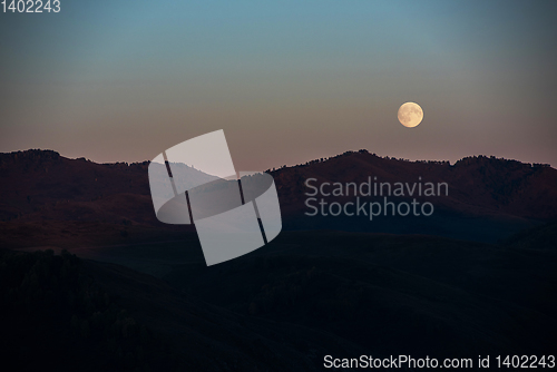 Image of Full moon at sunset