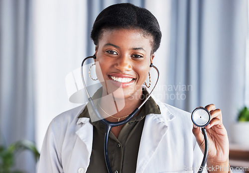 Image of Doctor, portrait and black woman with stethoscope for heartbeat, healthcare services and cardiology. Face, African female medical worker and listening tools to check heart, lungs and breathing test