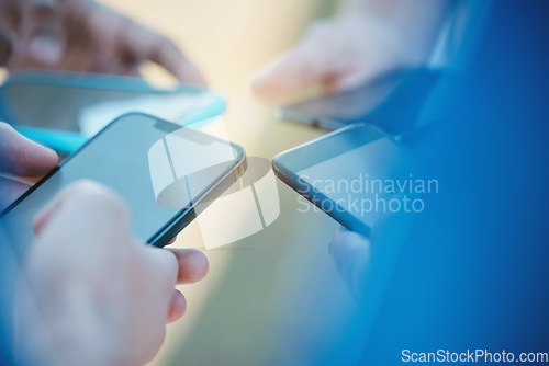 Image of Hands, phone and networking with people in a huddle or circle for communication or connectivity. Mobile, social media or information sharing and a person group standing together closeup with flare