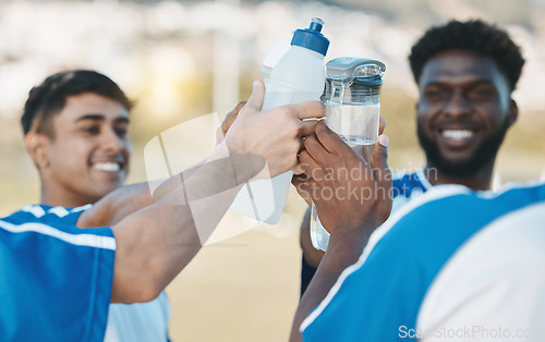 Image of Success, happy and men in soccer with water bottle after a game, sports win or celebration after training. Smile, drink and athlete people with a toast for achievement, motivation or goal in football