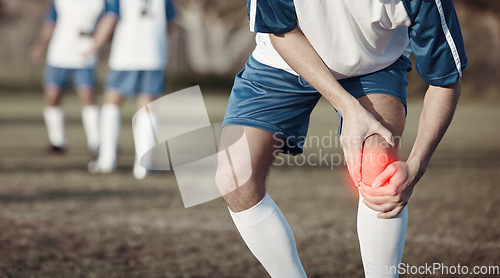 Image of Soccer player, knee pain or man with injury on field in sports training accident or workout game emergency. Closeup, red glow or injured football athlete suffering from leg muscle in fitness exercise