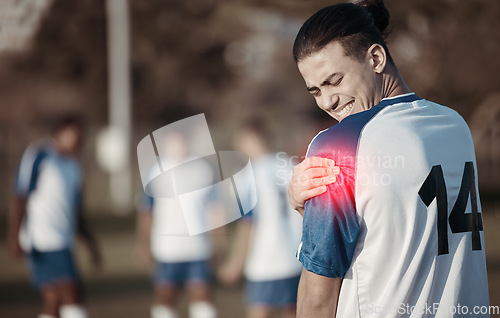 Image of Soccer player, shoulder pain or man with injury on field in sports training accident or workout game. Emergency, red glow or injured football athlete suffering from arm muscle in fitness exercise