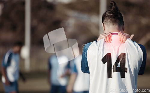 Image of Soccer player, injury or man with back pain on field in sports training accident or practice workout. Emergency, red glow or injured football athlete suffering from muscle tendon in fitness exercise