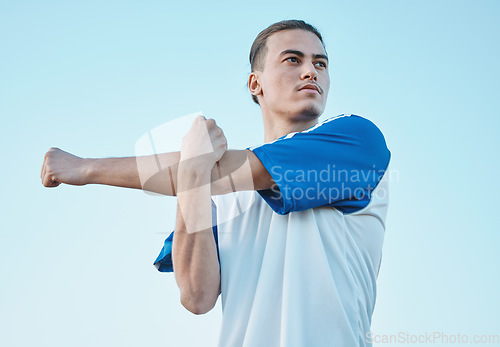 Image of Soccer, stretching and a sports man on a blue sky background in preparation for a game or competition. Fitness, health and warm up with a young male athlete getting ready for training or practice