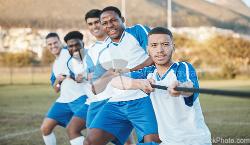 Image of Soccer player, men and tug of war on field with teamwork, strong and muscle, fitness and competition challenge. Male athlete group, football training and diversity, trust and team building in sports