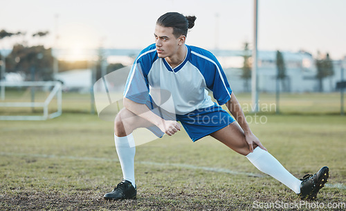 Image of Thinking, sports or soccer player stretching legs on football field in training, exercise or workout in Brazil, Fitness, warm up or serious male athlete ready to start practice match or stadium game