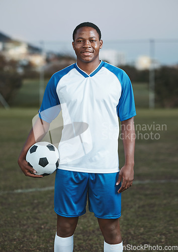 Image of Soccer ball, ready or portrait of black man on field with smile in sports training, game or match on pitch. Happy football player, fitness or proud African athlete in practice, exercise or workout