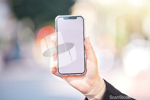 Image of Woman, hands and phone with screen mockup in city for advertising, social media or outdoor communication. Closeup of female person or mobile smartphone display for online app or network in urban town