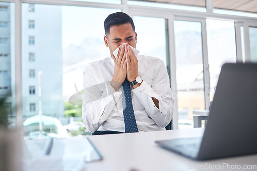 Image of Sick, allergy and blowing nose with business man in office for flu illness, hayfever and sneeze. Allergies, virus and sinus with employee and sneezing with tissue for influenza, cold and healthcare