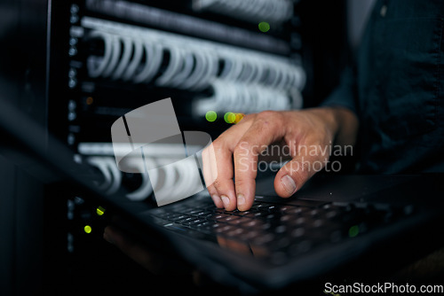 Image of Hands, laptop and typing in server room, man and inspection with coding, analysis and night for programming. Information technology expert, computer and keyboard for database, solution or maintenance