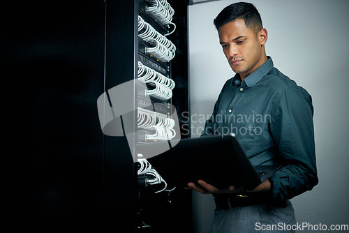Image of IT engineer man, laptop and server for inspection, thinking or troubleshooting with analysis, night or programming. Information technology expert, computer or database with problem solving mindset