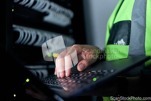 Image of Hands, keyboard and typing for server, cables or man for inspection, coding or analysis in night for programming. Information technology expert, computer and keyboard for database, solution and test