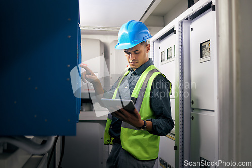 Image of Electrician, tablet and technician with man in control room for inspection, quality assurance and energy. Electricity, safety and industrial with handyman for maintenance, mechanic check or power box