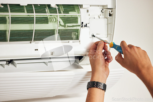 Image of Maintenance, air conditioner and hands of man with screwdriver for problem solving on machine. Aircon, ac repair and handyman service with technician, electrician or contractor working on ventilation