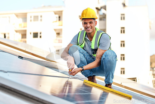 Image of Clean energy, solar panels and portrait of man on roof for installation, sustainable business and electricity. Engineer, sustainability and photovoltaic power on city rooftop with renewable resource.