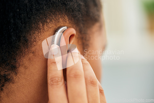 Image of Closeup of ear, hearing aid and person disability from the back for medical support, listening and healthcare technology. Deaf patient with audiology implant for sound waves, amplifier and innovation