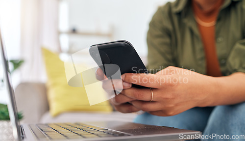 Image of Hands of woman on sofa with phone, laptop and typing for remote work, research and documents for online job. Internet, networking and home office, freelancer on couch with cellphone and computer.