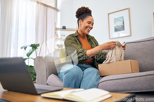 Image of Online shopping, woman on sofa with package and smile, discount fashion retail and laptop in living room. Delivery of clothes, ecommerce and happy person on couch with box from website sale or deal.