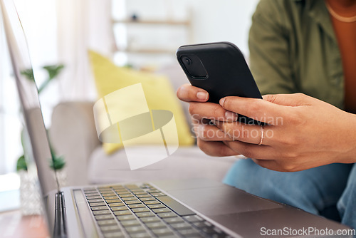 Image of Woman, hands and phone in social media, communication or online networking in living room at home. Closeup of female person or freelancer typing, chatting or texting on mobile smartphone app in house