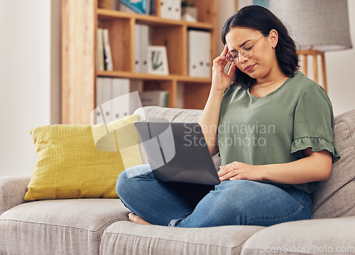 Image of Remote work from home, laptop and woman with a headache, fatigue and overworked with health issue. Female person, freelancer or girl on a couch with migraine, burnout or exhausted with pain or stress