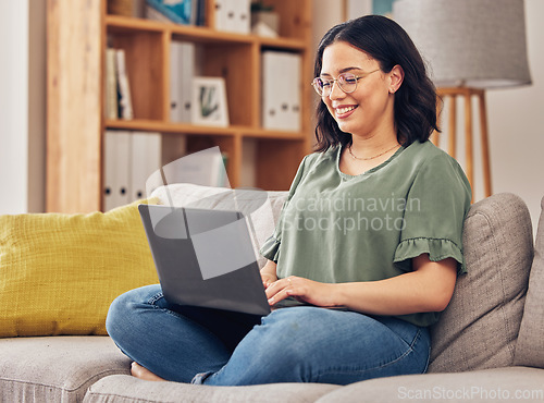 Image of Sofa, laptop and woman or student in e learning, online education and typing for university or work from home research. Computer, information or knowledge of young person on couch and college website