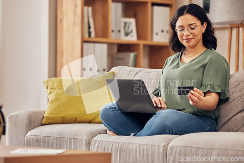 Image of Laptop, credit card and woman of home online shopping, e commerce or fintech payment on sofa. Relax, loan and happy person on internet banking, e learning subscription and computer or web transaction