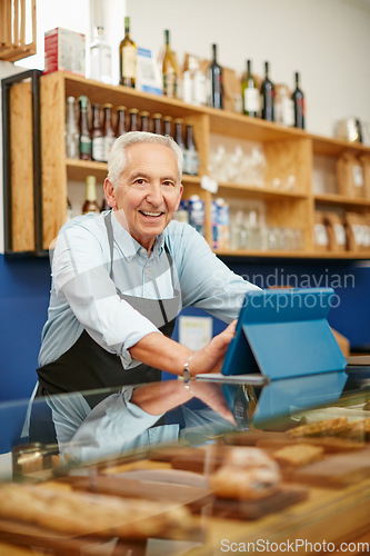 Image of My appetite for entrepreneurship never left me. Shot of a senior man working in a bakery.