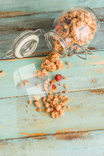 Image of Glass jar with healthy breakfast cereal 