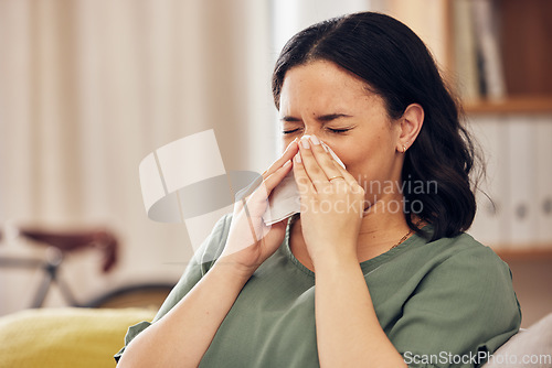 Image of Sick, allergy and blowing nose with woman on sofa for virus, hayfever or illness. Healthcare, disease and allergies with person and sneezing with tissue in living room at home for influenza and sinus