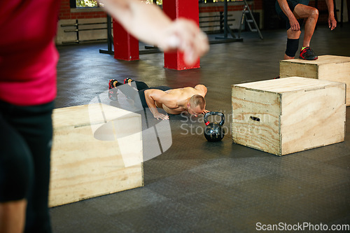 Image of Muscles are his motivation. Shot of a shirtless man doing push ups during his workout at the gym.