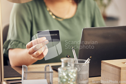 Image of Hands, credit card and laptop on desk, payment and home office for online shopping, sale and banking on internet. Woman, pc and fintech app for cyber security, discount or deal with e commerce store
