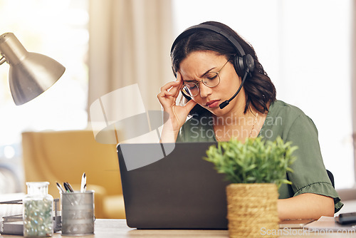 Image of Remote work, laptop and woman with a headache, headphones and fatigue with health issue. Female person, freelancer and telemarketing agent with a migraine, burnout and overworked with pain and tired