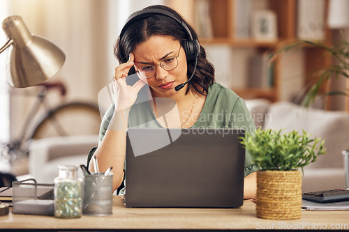 Image of Woman, headache and call center for work from home office with stress, headphones or mic for crm with laptop. Customer care, tech support agent or tired for contact us, help desk or telemarketing job
