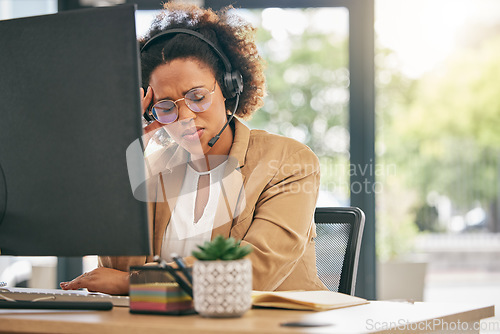 Image of Stress, call center and headache of woman at computer in customer service agency with pain, burnout and anxiety. Frustrated African consultant at desktop with challenge of client account problem