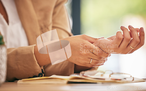 Image of Hands, business woman and pain in wrist from osteoporosis, orthopedic injury or health risk. Closeup of worker, carpal tunnel and muscle problem from joint stress, fibromyalgia or first aid in office