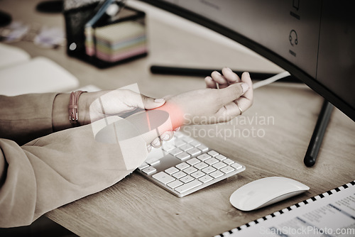Image of Hands, business person and red wrist pain at computer for osteoporosis, orthopedic injury and health risk. Closeup of worker, carpal tunnel and glow of muscle problem in stress, fibromyalgia or sepia