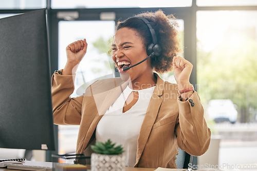 Image of Business woman, call center and celebrate at computer for winning, sales bonus or telemarketing goals. Happy African consultant with pride of success, achievement or fist of good news at desktop