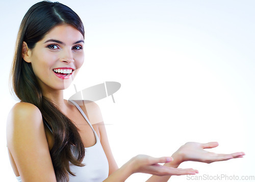 Image of Its a offer you cant refuse. Cropped shot of a beautiful young woman posing against a white background.