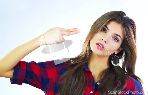 Image of Im not impressed...Shot of a young woman posing against a white background.