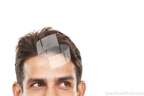 Image of Intrigued by your copyspace. Cropped shot of a young mans face looking sideways at copyspace.