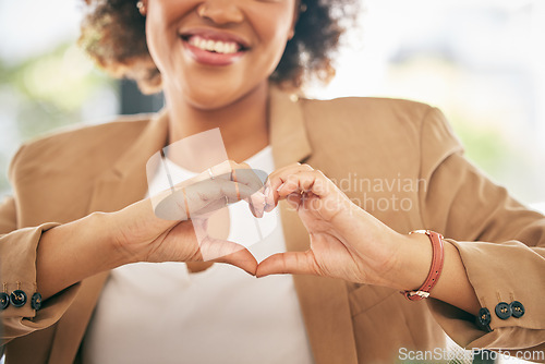 Image of Hands, heart and business woman with love emoji for care, kindness and like in office. Closeup of happy female worker with finger shape for thank you, trust and sign of hope, support icon and peace