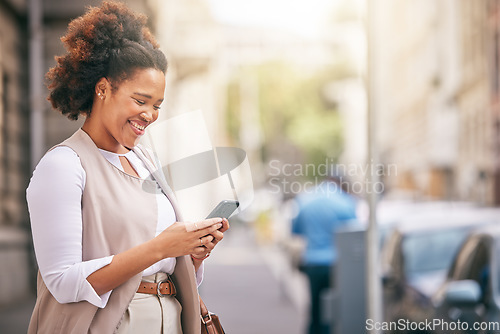 Image of Phone, city and business woman walking and travel in a town typing on social media, online or internet. Connection, smile and happy African person texting a contact via email, web or mobile app