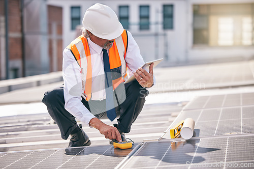 Image of Tablet, solar panels and engineering man on rooftop, city and urban development, sustainability or energy saving installation. Digital technology, inspection and electrician or person with power grid