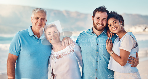 Image of Portrait, diversity and love with a blended family on the beach together in summer for vacation or holiday. Senior parents, smile and in laws with a group of people standing y by the ocean or sea