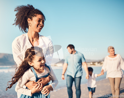 Image of Mother, child and playing outdoor at the beach on a family vacation, holiday or adventure in summer. Excited young girl kid and a woman with fun energy, happiness and love or quality time at sea