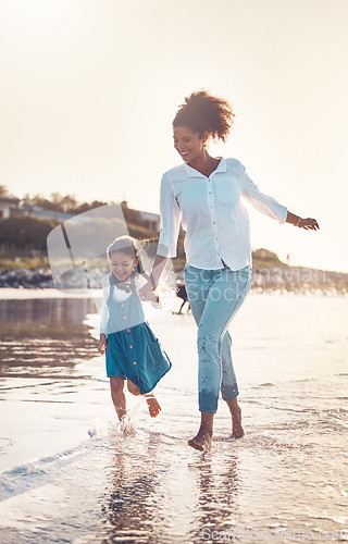 Image of Fun, child and a mother running at the beach on a family vacation, holiday or adventure in summer. Young girl kid holding hands with woman outdoor with fun energy, happiness and love at sunset ocean