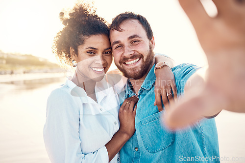 Image of Selfie, smile and happy couple on beach for holiday to celebrate love, marriage and memory on social media. Digital photography, man and woman relax on ocean vacation together in summer with nature.