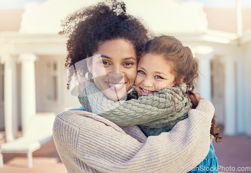 Image of Portrait, happy mother and girl in backyard, hug and bonding together by home. Face, kid and multiracial African mom with foster child, love and care with a smile for quality time outdoor by house